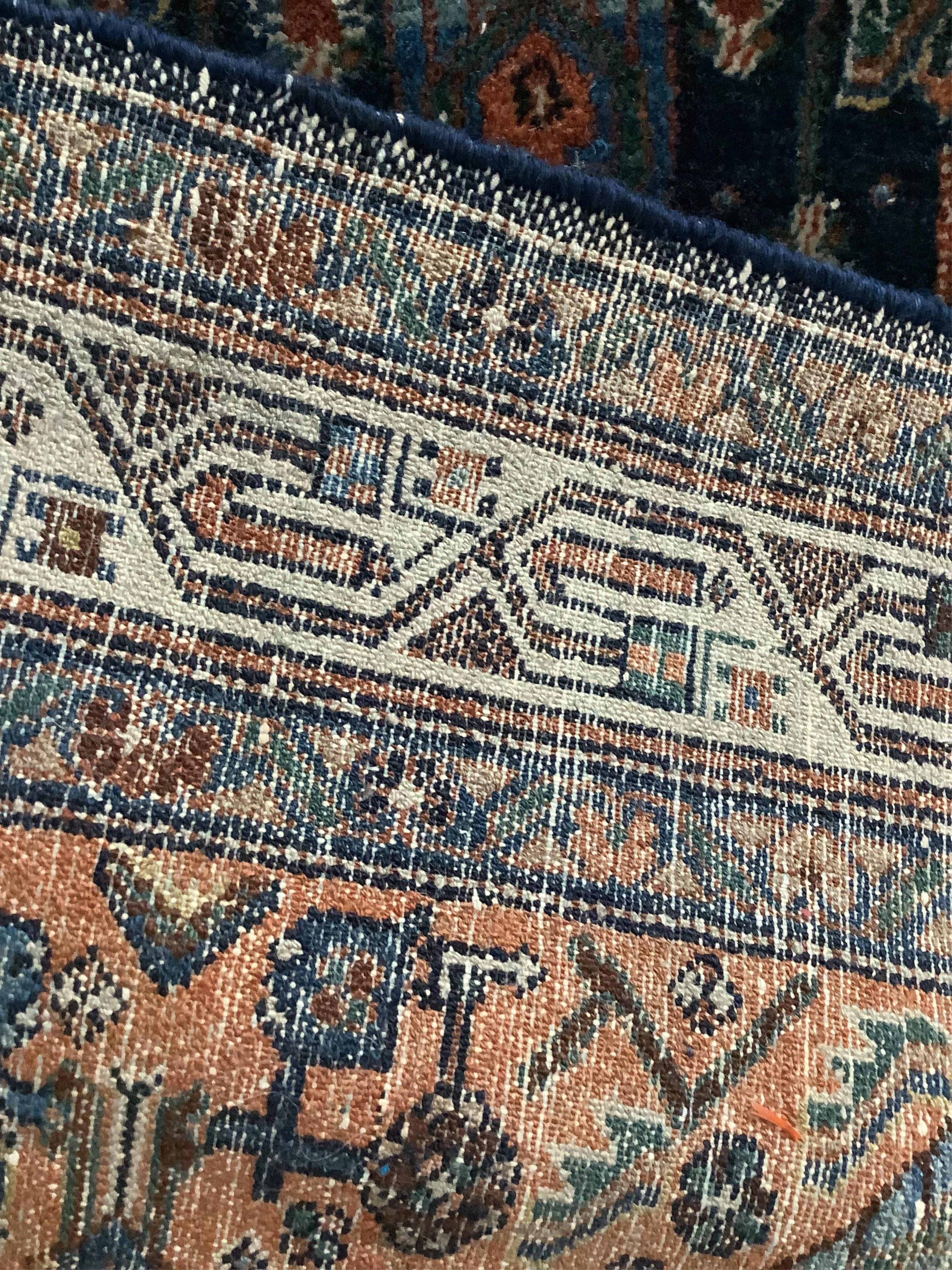 A North West Persian blue ground rug, 194 x 130cm. Condition - fair